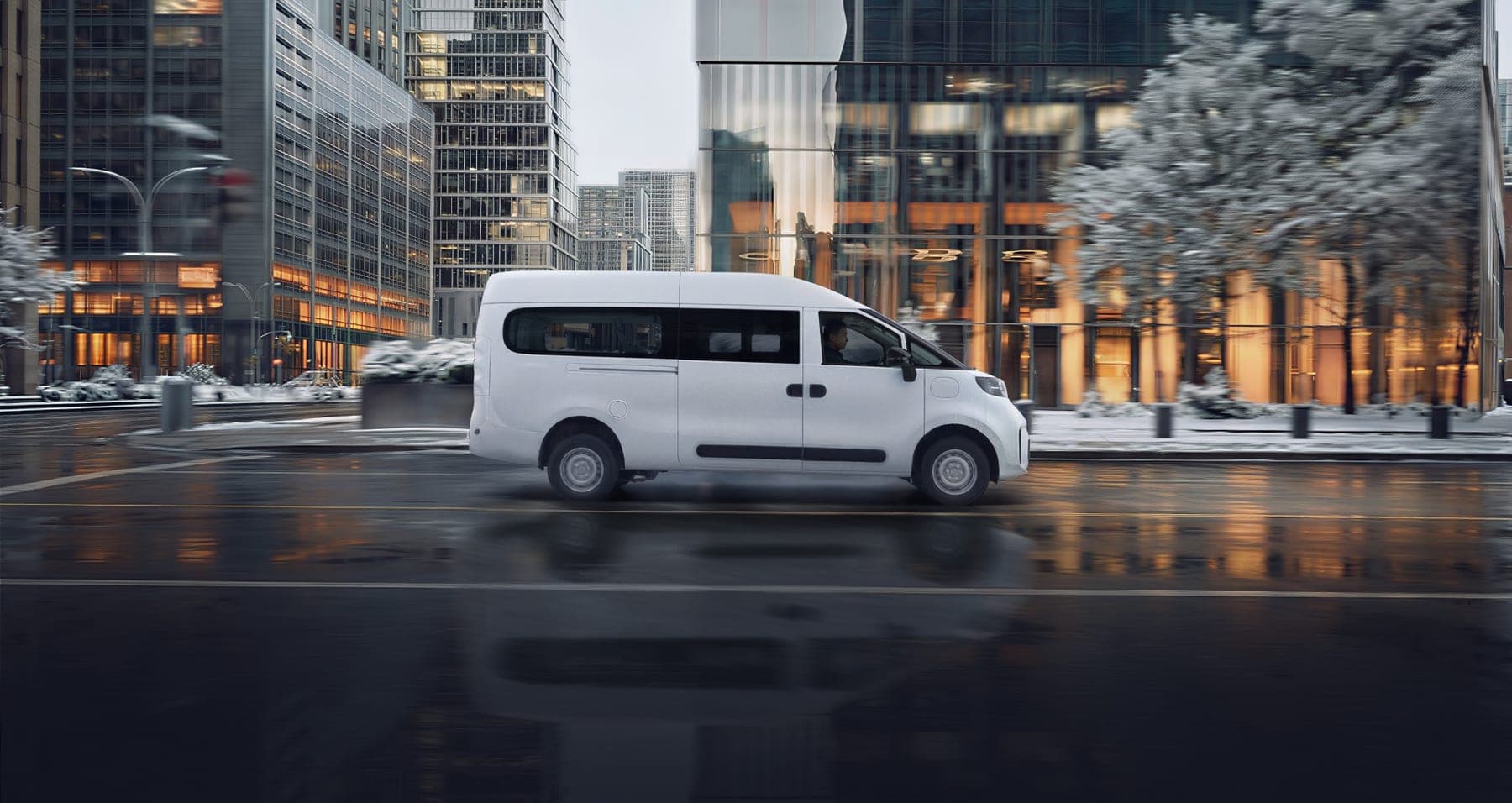 2026 MAXUS Dana Super EREV Van — Range-Extender Electric Cargo Van for export, side view in a winter city street