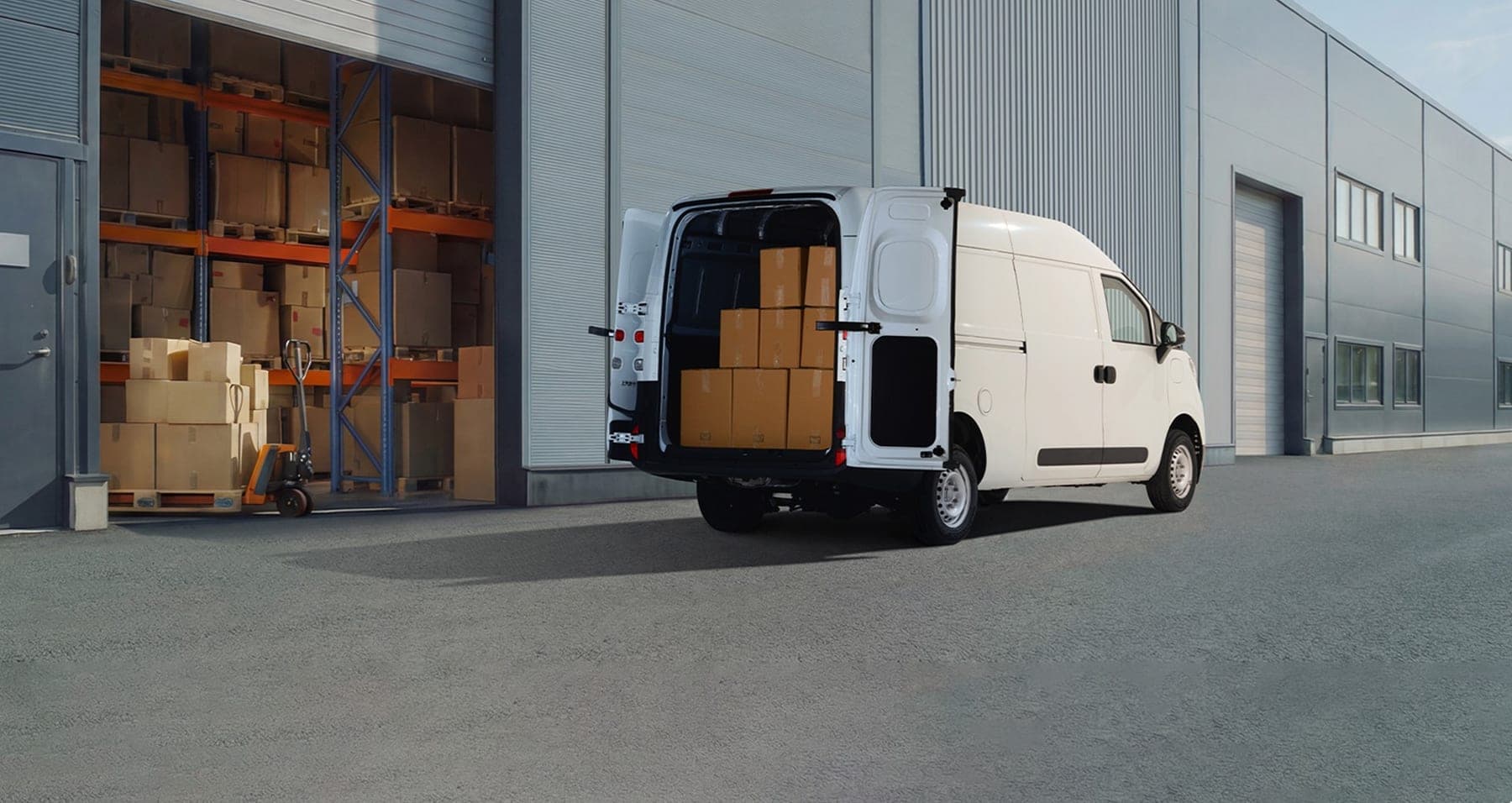 2026 MAXUS Dana Super EREV Van — Range-Extender Electric Cargo Van for export, loaded cargo bay at a distribution warehouse